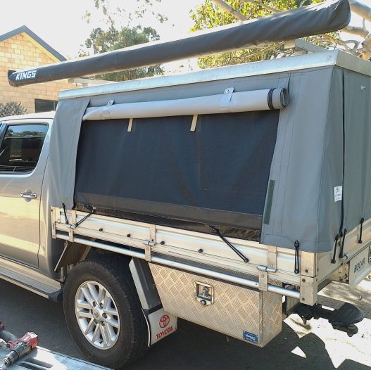 hardtop canopy with roof racks and awning